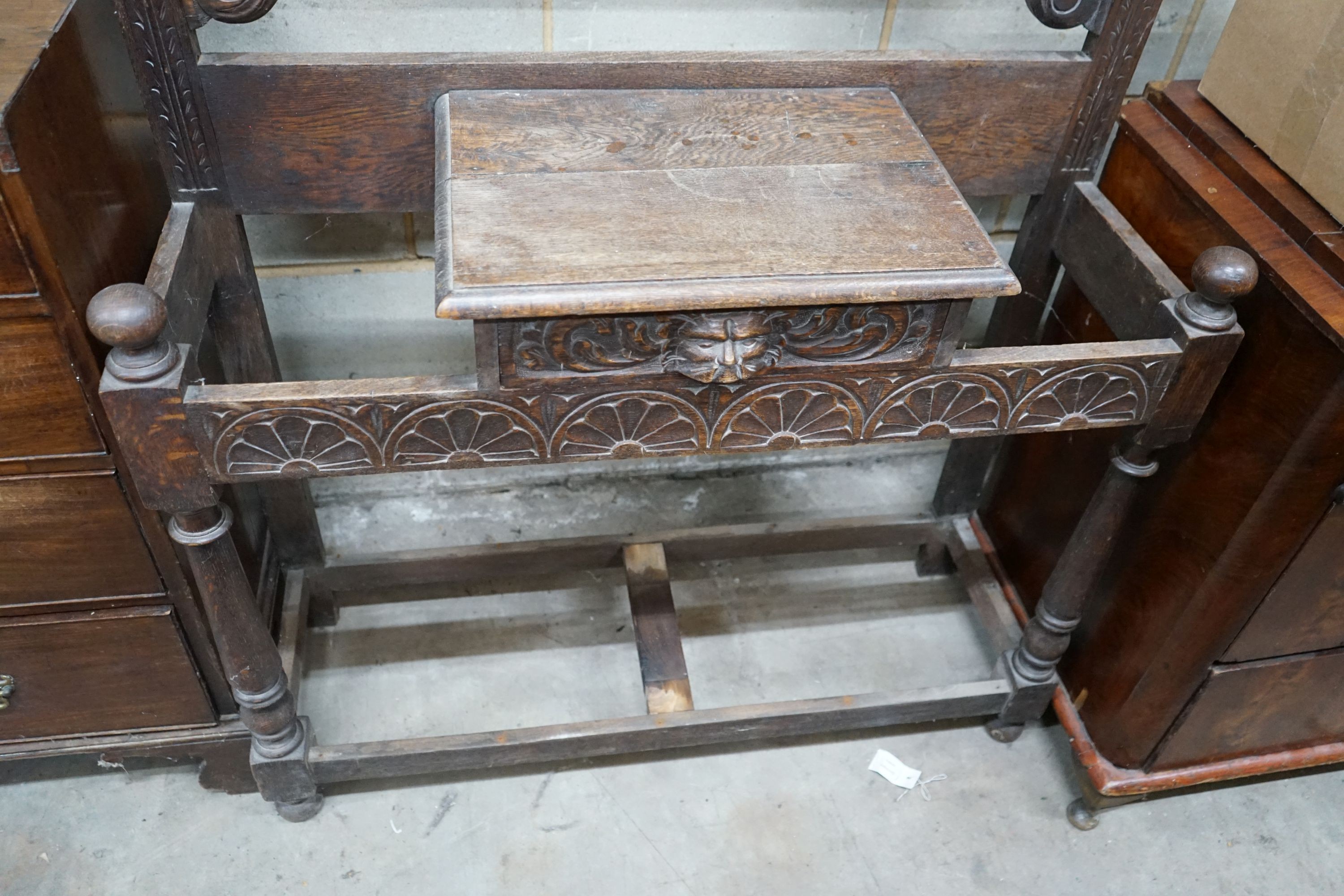 A late 19th century Flemish carved oak hallstand, width 106cm, depth 36cm, height 198cm